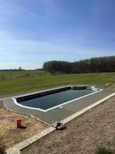Custom stamped concrete pool deck designed by Morrison Custom Concrete