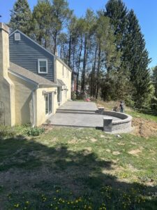 Newly installed stamped concrete patio with intricate stone patterns