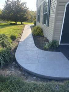 Stamped concrete walkway with a natural stone imprint