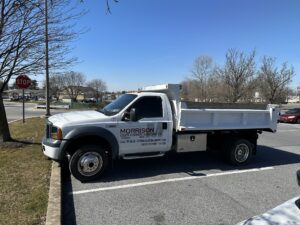 Morrison Custom Concrete branded service truck parked roadside, ready for residential and commercial concrete installation projects