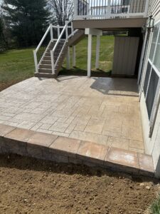 Stamped Concrete patio design with light-colored finish for heat reflection and slip resistance.